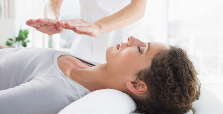 Woman having reiki treatment